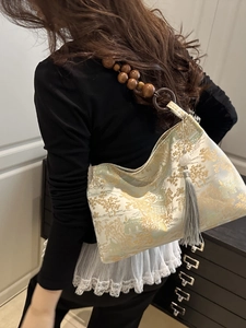 Oriental jacquard baguette bag with landscape patterns and wooden bead strap