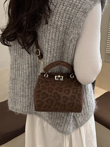 Minimalist leopard print tote bag with metal twist lock and adjustable shoulder strap
