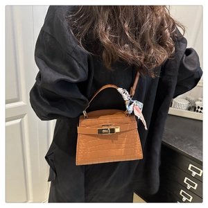 Brown crocodile leather handbag with silk scarf handle and golden lock clasp