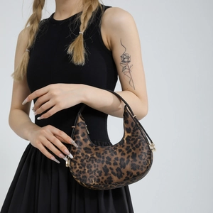 Fashionable leopard print crescent hobo bag with black handle and gold metal zipper