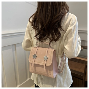 Pink mini backpack detail with silver stars on synthetic leather for a trendy look