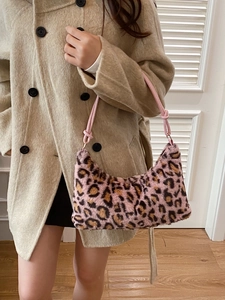 Pink faux fur leopard print underarm bag with knot strap detail and curved structure