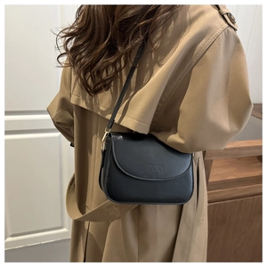 Detail view of black PU leather shoulder bag with Fashion Bags lettering on flap