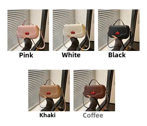 Detailed view of cherry-decorated crossbody bags in multiple colors with top handles