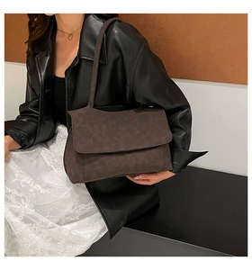 Fashionable dark coffee suede tote bag styled with a leather jacket and lace skirt