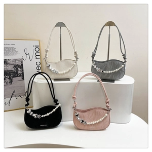 Detailed collection of textured underarm bags in four colors with pearl heart charms