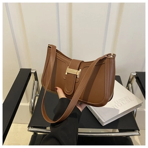 Brown faux leather hobo bag with vintage gold square buckle and decorative strap detail