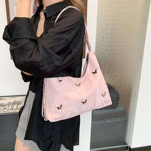 Pink butterfly shoulder bag with pleated texture and stylish metal accents for women