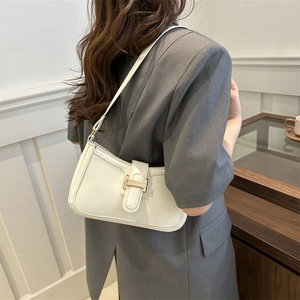 Minimalist cream white PU leather crescent bag with gold buckle and slim strap