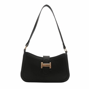 Minimalist black crescent shoulder bag with a gold metal H-shaped clasp on white background