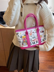 Sac cabas en toile graffiti avec bordure en cuir rose et motifs de dessins animés