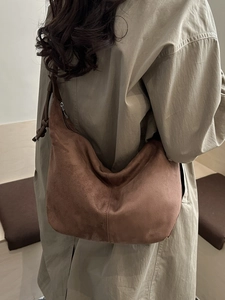 Brown suede hobo tote bag for women showing a stylish minimalist shoulder strap design