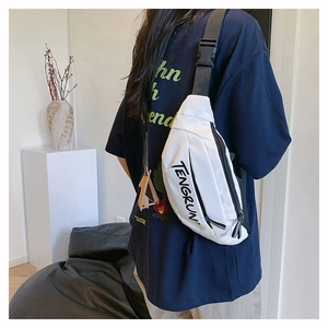 Close-up of white crossbody fanny pack featuring adjustable black strap and buckle