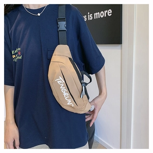 Detailed view of khaki TENGRUN chest bag with adjustable strap and white lettering