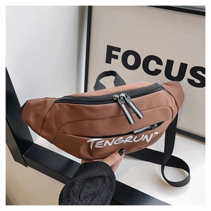 Close-up of durable dark brown canvas waist bag with adjustable strap and front zipper
