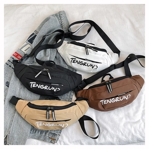 Detail view of four casual waist bags in white black coffee and khaki canvas colors