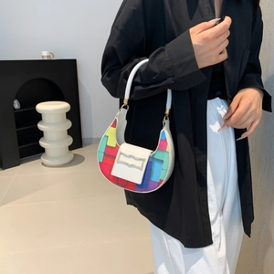 Fashionable half-moon shoulder bag with colorful geometric patterns and white leather handle