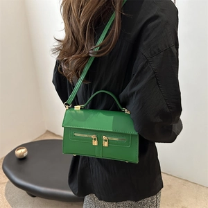 Retro grass green crossbody bag in polished leather with gold hardware and top handle