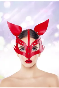 Close-up of red leather fox mask with metallic rivets for cosplay party outfits