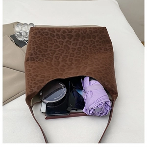 Spacious tote bag interior showing capacity for umbrella, phone, and cosmetics