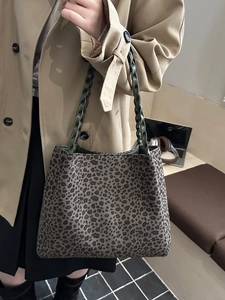 Leopard print tote bag with dark green woven handles for stylish daily commute use
