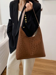 Minimalist large leopard print tote bag styled as a shoulder hobo bag for women