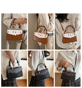 Detail of vintage square crossbody bags showing knotted handles and patterned flaps
