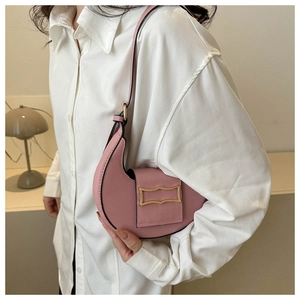 Detailed view of pink moon bag with stone pattern and gold metal buckle detail