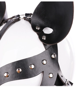 Close-up of black leather mouse ear mask with silver rivets for cosplay or party