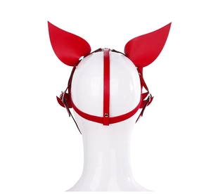 Macro shot of red leather fox ear mask with adjustable metal buckles on white model