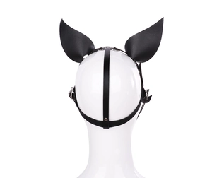 Detail of black leather fox mask with silver rivets and adjustable straps on white mannequin