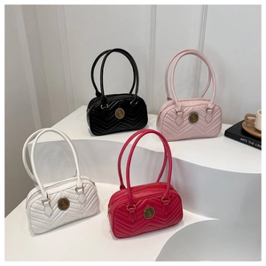 Quilted oval baseball-style shoulder bags in multiple colors with retro metal logo detail