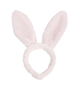 Close-up of soft plush light pink rabbit ear headband with fluffy texture for Easter party