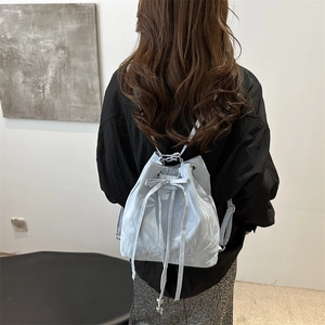 Minimalist light blue drawstring bucket backpack with textured fabric for women