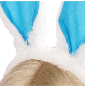 Close-up of white plush bunny ears headband with sky blue inner fabric on blonde hair