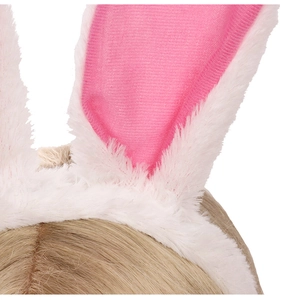 Detail shot of white plush rabbit ears headband with soft pink inner fabric textures