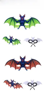 Detail view of blue and red bat-shaped Halloween glasses with plastic frames and wings