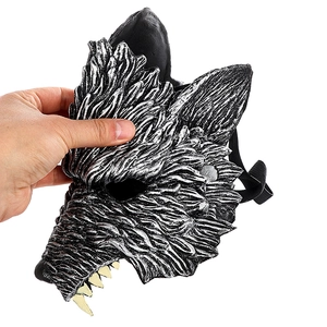 Detailed view of silver wolf mask with realistic fur texture and yellow fangs for parties