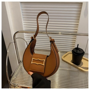 Detailed close-up of brown stone-pattern hobo bag with elegant gold wavy buckle