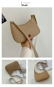 Detail view of khaki hobo bag with pebble leather texture and golden metal zipper hardware