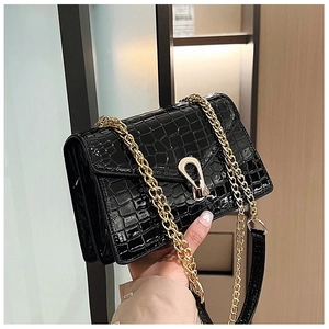 Classic black crocodile pattern crossbody bag with gold chain and horseshoe lock
