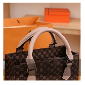 Macro shot of vintage plaid handbag handles with high-quality stitching and metal buckles