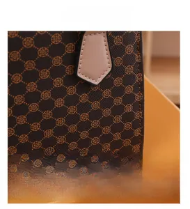 Close-up of retro geometric circular pattern and fine stitching on synthetic leather bag