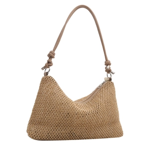 Minimalist woven straw tote bag with knot strap detail and silver zipper for women