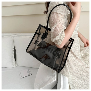 Detail of transparent PVC tote bag with black trim and inner pouch for women