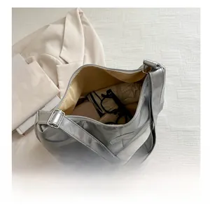 Top view of spacious silver tote bag interior showing large capacity for daily items