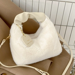 Chic beige faux fur handbag with ruched leather handle and detachable crossbody strap