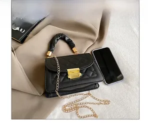Quilted crossbody bag size comparison with a smartphone showing compact interior space