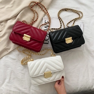 Quilted chevron flap bags in red, black, and white with elegant gold chain straps
