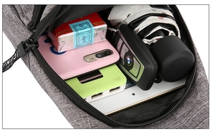 Detailed interior of gray sports chest bag showing large capacity and internal compartments